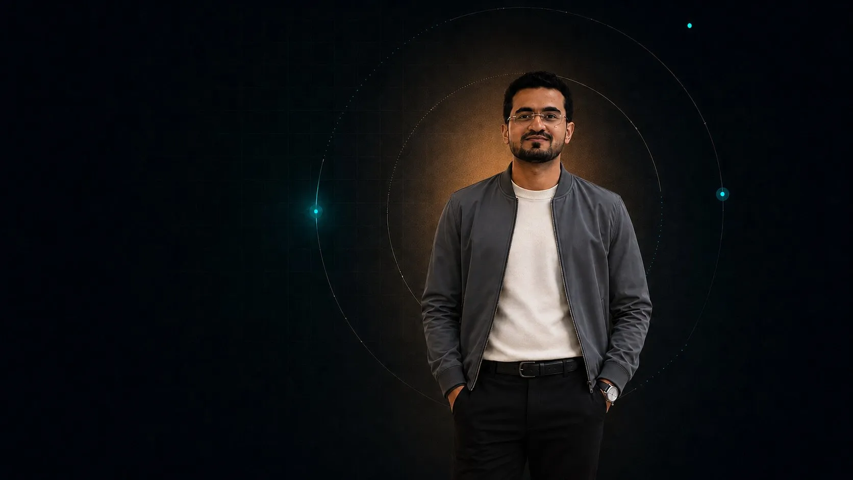 Talha Ansari standing within an orbital ring motif on a dark stage